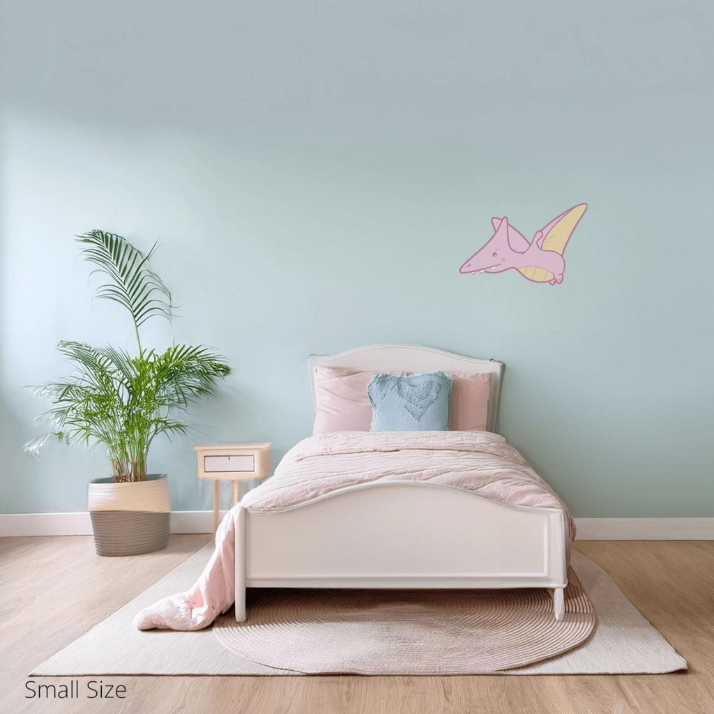 Petra the Pterodactyl wall sticker applied on a child’s bedroom wall – small size, showing placement in kids’ room