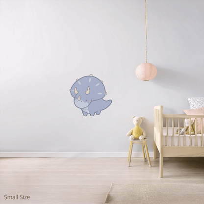 Tracy the Triceratops wall sticker applied on a child’s bedroom wall – small size, showing placement in kids’ room
