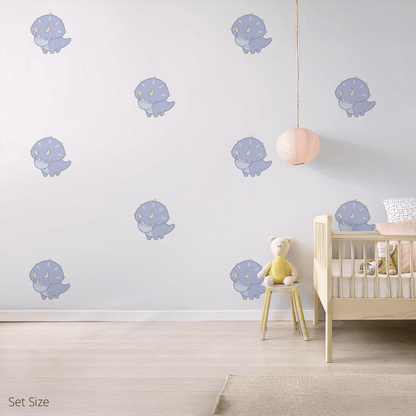 Tracy the Triceratops wall sticker applied on a child’s bedroom wall – set size, showing placement in kids’ room